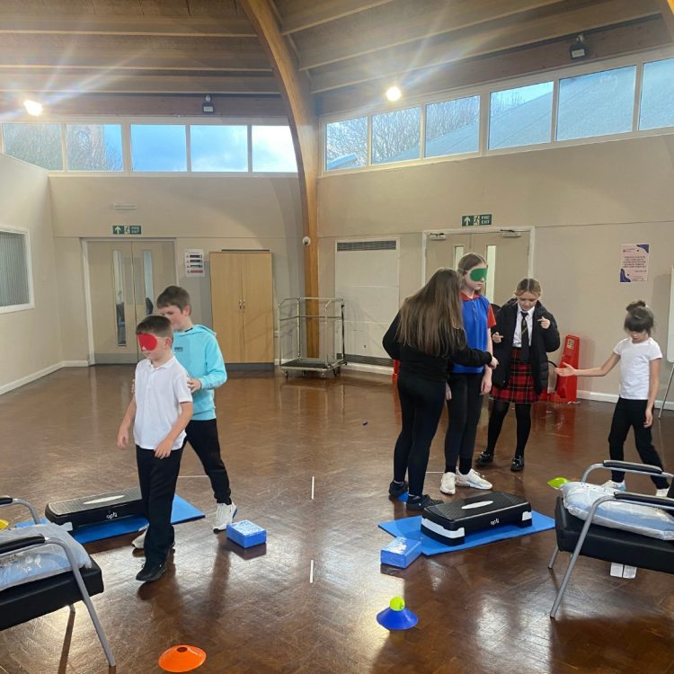 2 boys and 4 girls taking part in challenging activities.