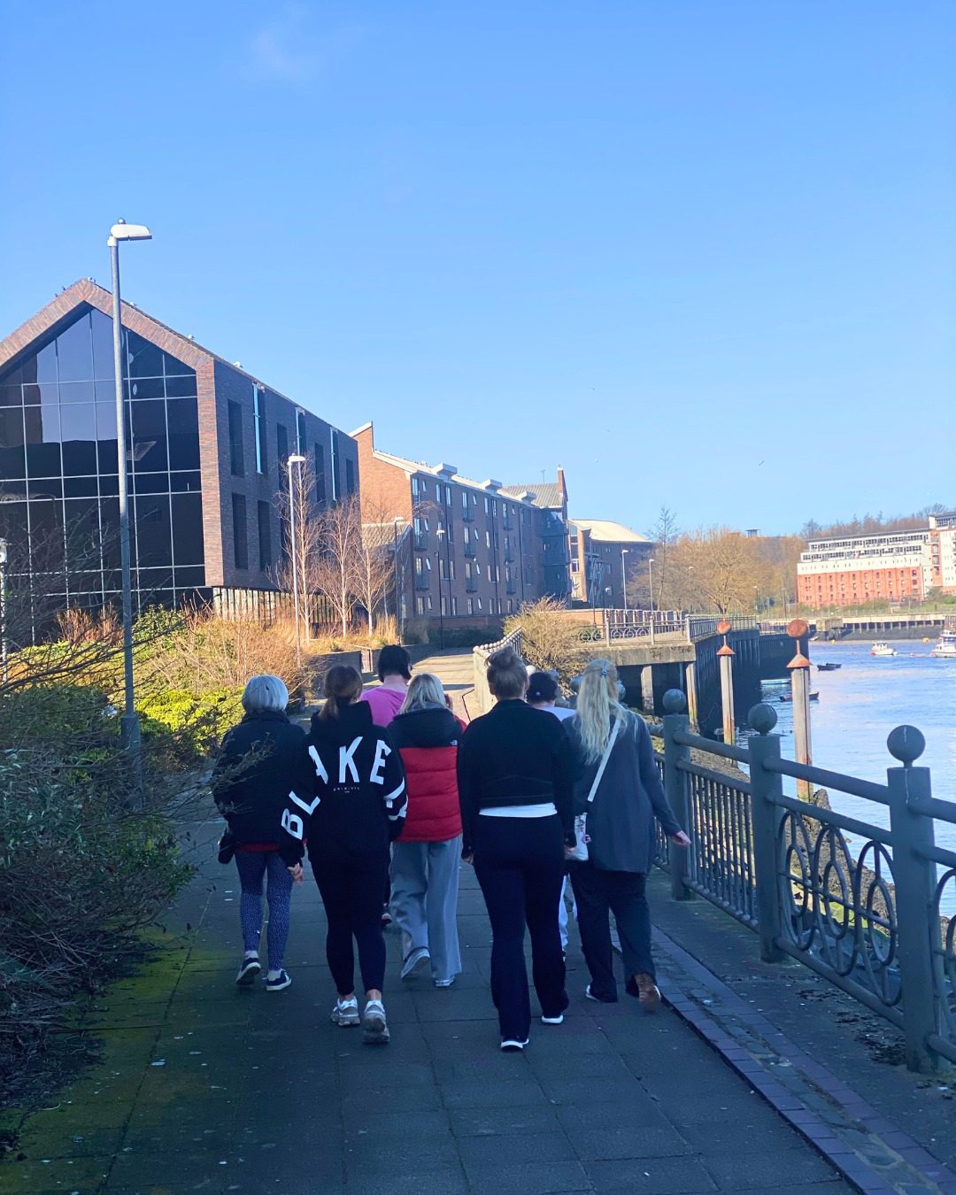 Women walking along River Wear