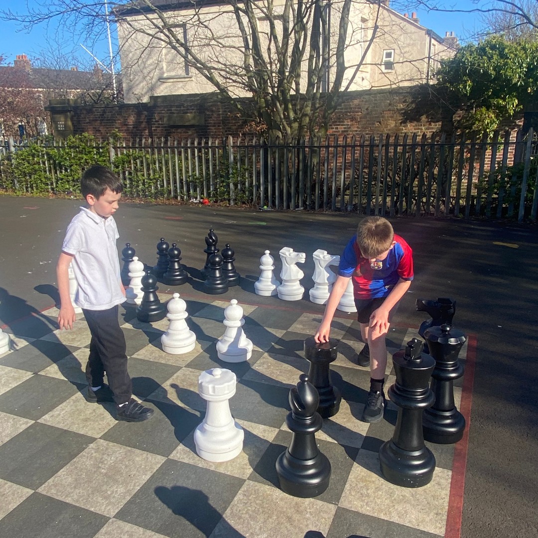 Two boys playing Chess during My Space