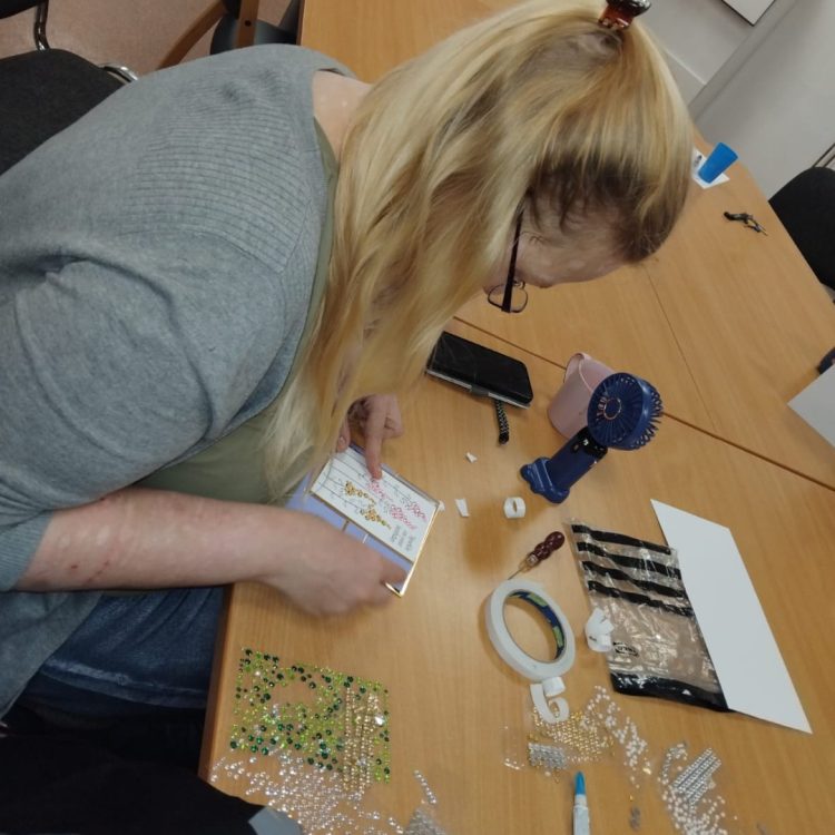 Craft Group member making a card.